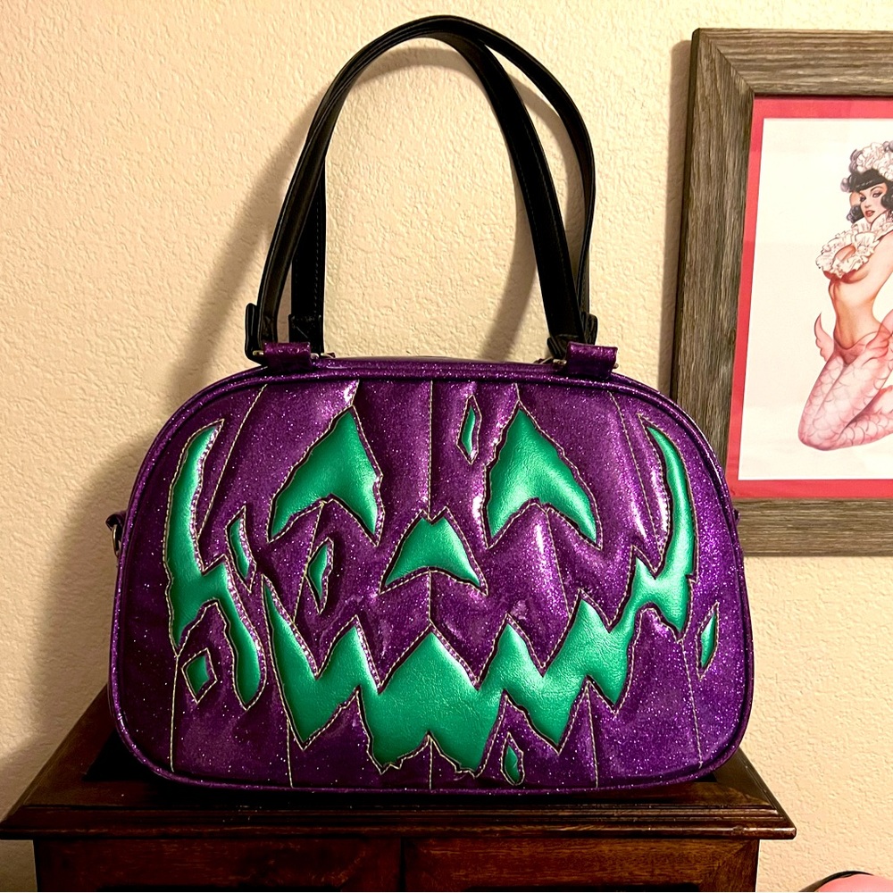 LOVE PAIN AND STITCHES boxy purple glitter w/ metallic green face